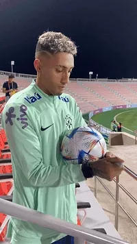 Player signing ball